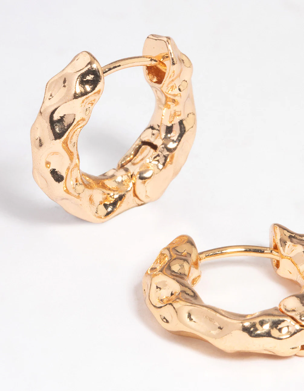 Gold Hammered Thick Huggie Earrings - Image 2