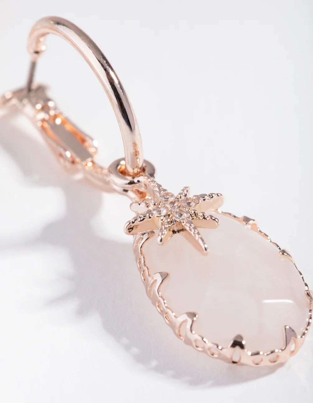 Rose Gold Star Charm Huggie Earrings - Image 3